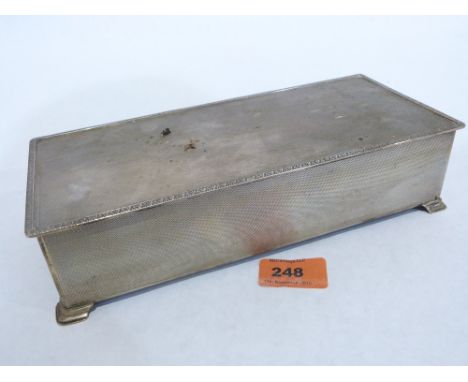 An Elizabeth II silver engine turned cigarette box. Engraved inside lid. Birmingham 1965. 10' wide