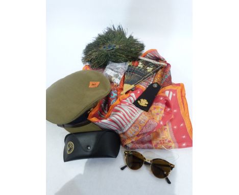 A military cap, buttons, an epaulette, two pairs of sunglasses, lady's headscarf, peacock feather fan etc.