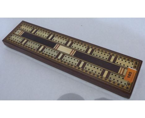 An early 20th century rosewood, marquetry and line inlaid cribbage board. 16' long