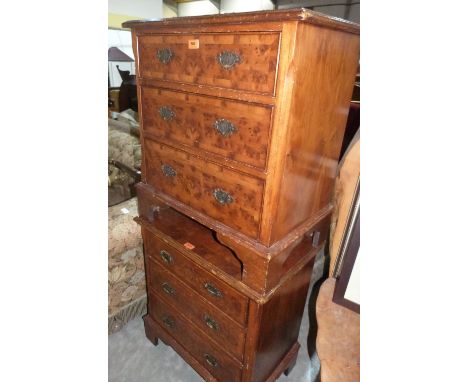 A pair of yew veneered chest of three long drawers on bracket feet. 25' wide