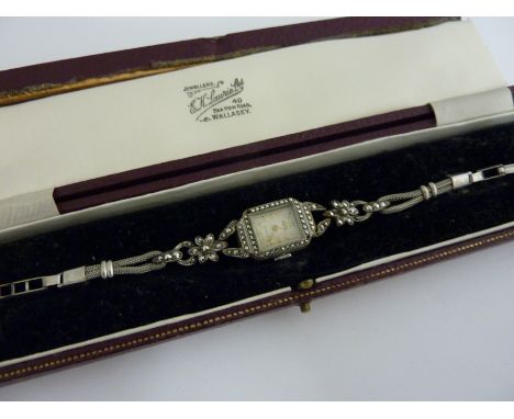 A VINTAGE MARCASITE LADIES WRISTWATCH, circa 1920, with flower shape detail, with original box