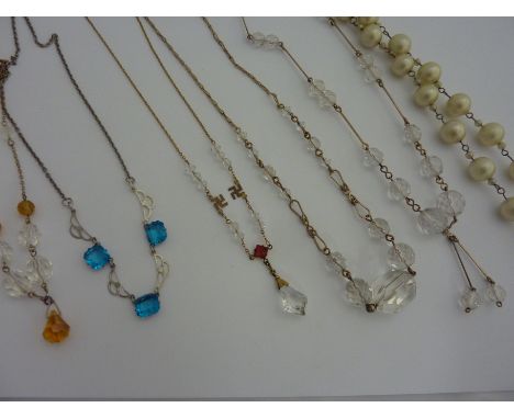 VINTAGE NECKLACES, to include a 1930's beaded chain necklace with swastika motif, together with a further four, short chained