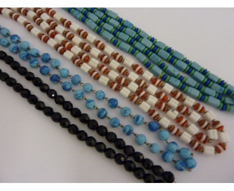 FOUR VINTAGE NECKLACES, two long length 1920's beaded necklaces together with a 1950's faceted black beaded necklace and anot