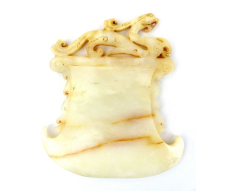 A Chinese white with brown and ochre pigment carved jade dragon axe blade, 14 x 11cm.