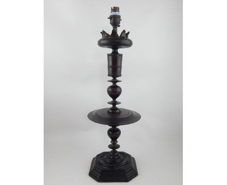 18th century style turned hardwood candlestick with circular drip tray on octagonal foot 43cm h. (drilled).