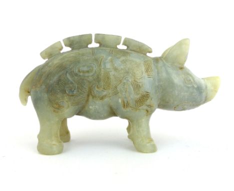 A Chinese carved all round green/grey jade figure of a standing pig, in the style of the Ch'ing Dynasty (Qing) carvers, 8 x 1