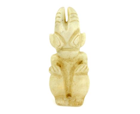 A rare translucent carved quartz or ''mutton fat'' Chinese jade figure of a crouching horned demon, 18cm high, in the early H