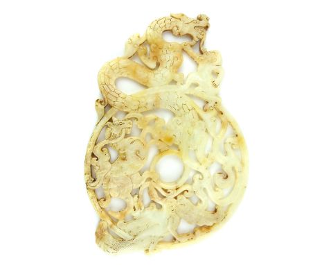 A fine Han style carved and pierced pi roundel decorated with monkey, dragon, kylin and phoenix, the white jade opaque and tr