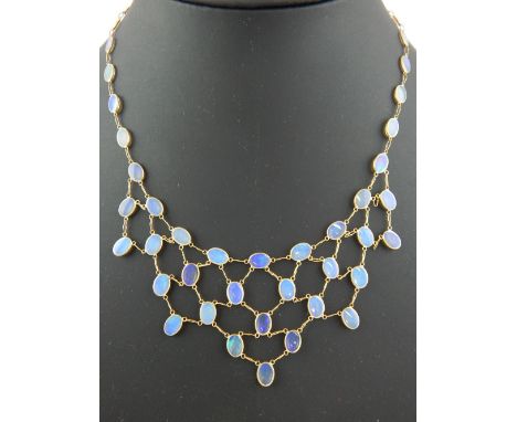 14ct yellow gold opal necklace set with oval cabouchon stones.