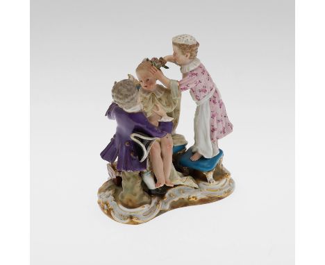 Late 19thc, modelled with a seated young girl  with two attendants, with an open jewellery box by her chair. 'Meissen Crossed