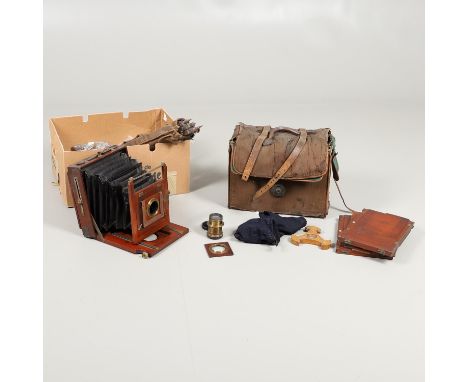 Made by Houghtons, a large mahogany plate camera with two brass lenses marked 'E J Underwood, 1/1, Plate Rapid, and 'Wide Ang