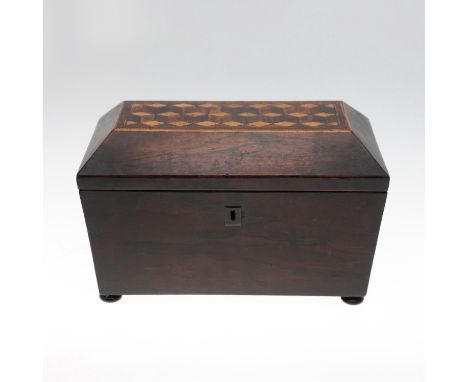 A Victorian tea caddy of sarcophagus shape, with an inlaid chevron design to the lid and the lids of the caddies inside. Also