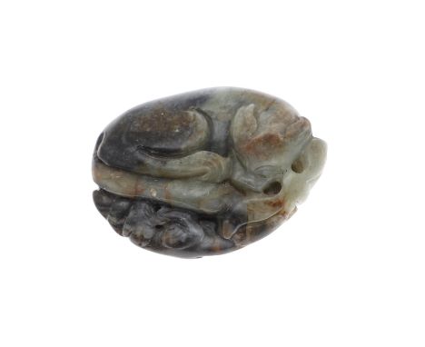 19thc, the celadon and black jade carved with a mythical animal with tail curved inwards, and with a smaller carved animal on