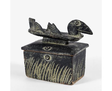 The rectangular lidded box with stylised bird shaped handle to the lid, and with incised reeds to three sides. With a 'JM' mo