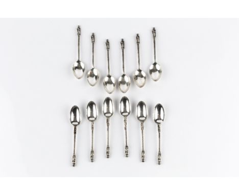 A SMALL COLLECTION OF SILVER, comprising two sets of six apostle topped coffee spoons, a Victoria Diamond Jubilee spoon, a pa