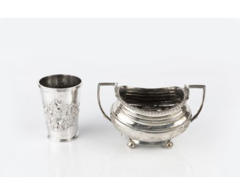 A LATE VICTORIAN SILVER BEAKER with reeded borders, embossed with a cartouche of scrolling foliage, by Josiah Williams & Co.,