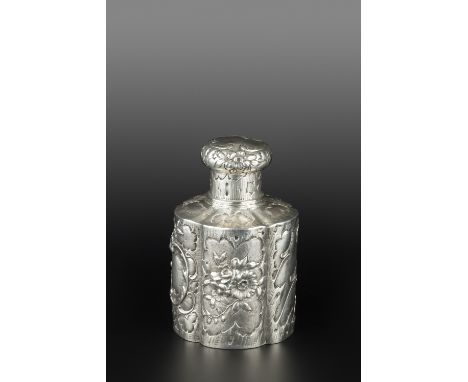 A LATE 19TH CENTURY GERMAN SILVER TEA CADDY AND COVER, of lobed cylindrical form, embossed and engraved with panels of flower