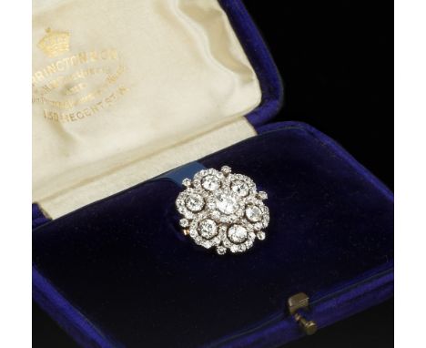 A LATE VICTORIAN DIAMOND CLUSTER BROOCH/PENDANT, designed as a flowerhead of old-cut diamond clusters in pinched claw setting