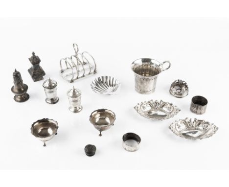 A COLLECTION OF SILVER, comprising a cup, with faceted sides and loop handle, 8cm high (marks worn), a five bar toast rack by