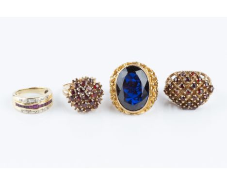 A COLLECTION OF DRESS RINGS, comprising a ruby and diamond half hoop ring, stamped '750', a blue synthetic spinel single ston