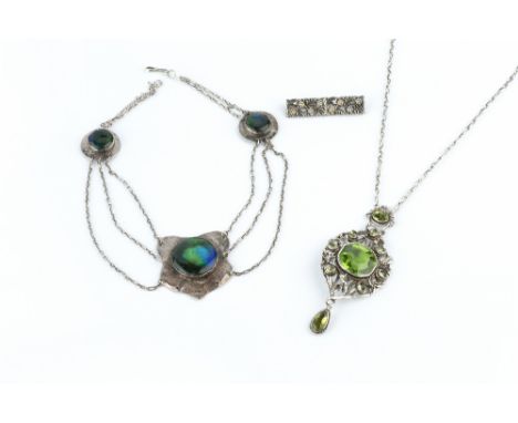 AN ARTS AND CRAFTS PENDANT NECKLACE, designed as a trio of hammered panels, each centred with a ceramic roundel, connected by