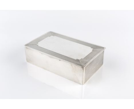 A SILVER RECTANGULAR CIGARETTE BOX, with engine turned top, by Mappin &amp; Webb, Birmingham 1965, 15.2cm