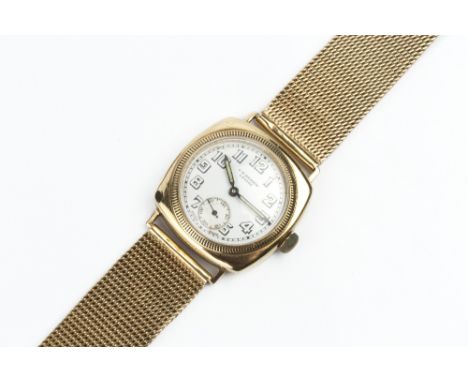 A GENTLEMAN'S WRISTWATCH, the circular white dial with Arabic numerals and subsidiary seconds dial, signed J. W. Benson, to a