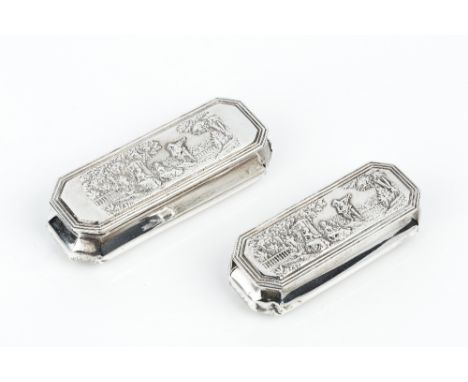 A LATE VICTORIAN SILVER RECTANGULAR SNUFF BOX, and a matching slightly smaller snuff box, with chamfered corners, the tops em