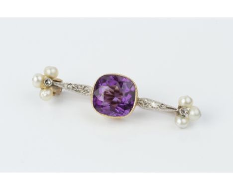 AN AMETHYST, PEARL AND DIAMOND BROOCH, centred with a cushion-shaped amethyst in millegrain collet setting, to a tapered bar 
