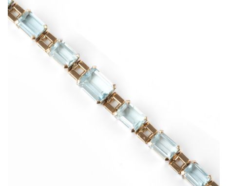 AN AQUAMARINE SET BRACELET, designed as a line of graduated rectangular step-cut aquamarines in four claw settings, spaced by