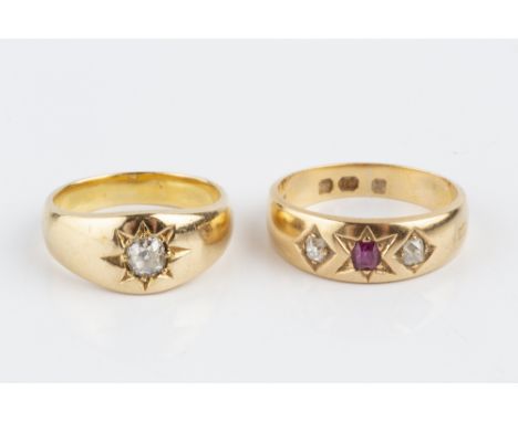 TWO DIAMOND SET GYPSY RINGS, the first a ruby and diamond three stone ring, 18ct gold mounted, the second a diamond single st