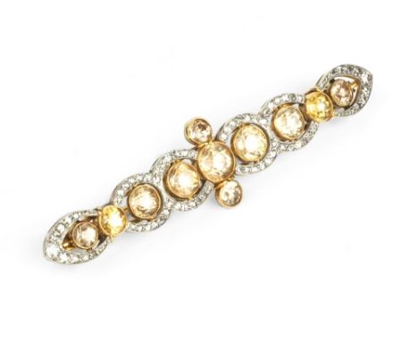 A DIAMOND AND GEM SET BAR BROOCH, designed as a line of circular mixed-cut brown zircons and yellow gemstones in millegrain c