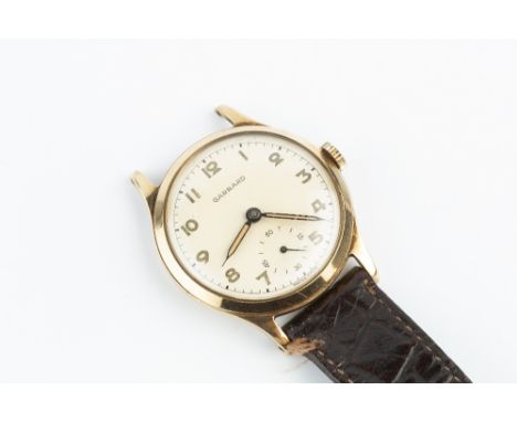 A GENTLEMAN'S 9CT GOLD WATCH HEAD BY GARRARD, the circular signed dial with Arabic numerals and subsidiary seconds dial, to a