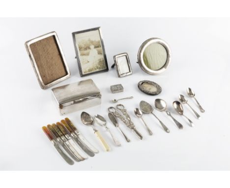A SILVER CIGARETTE BOX, with engine turned decoration, Birmingham 1928, 14cm wide, together with five various silver photo fr