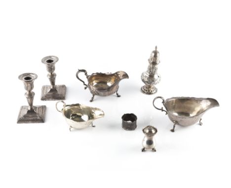 A COLLECTION OF SILVER, comprising a pair of late Victorian dwarf candlesticks, London 1899, weighted bases, three various sa