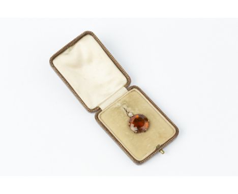 A CITRINE AND DIAMOND PENDANT, the circular mixed-cut citrine claw set below a cushion-shaped old-cut diamond in millegrain c