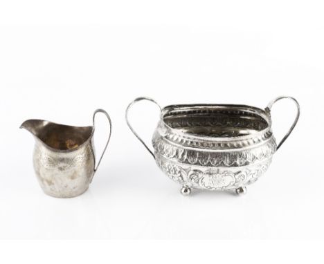 A GEORGE III SILVER TWIN HANDLED SUCRIER, embossed and engraved with flowers and scrolling foliage, on ball feet, maker's mar