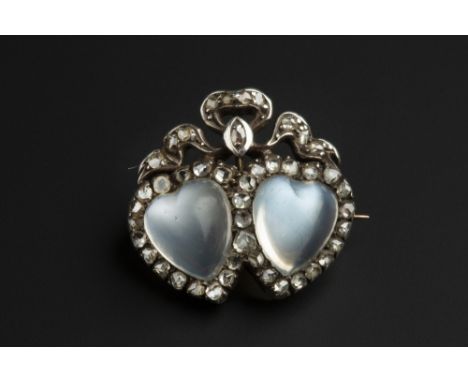 A LATE VICTORIAN MOONSTONE AND DIAMOND DOUBLE HEART BROOCH, modelled as two entwined heart-shaped clusters, each centred with