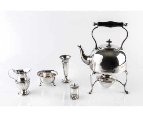 A SMALL COLLECTION OF SILVER, comprising a baluster cream jug, Birmingham 1908, a sugar basin, a pepper, and a small spill va