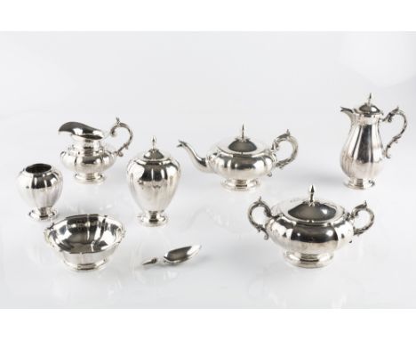 A DUTCH SILVER SEVEN PIECE TEA SERVICE, of shaped outline, comprising teapot and cover, hot milk jug with hinged cover, twin 