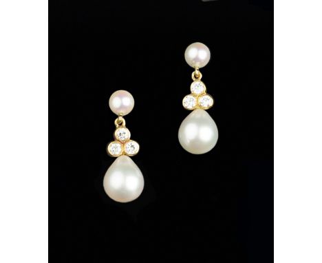 A PAIR OF CULTURED PEARL AND DIAMOND EAR PENDANTS, each pear-shaped cultured pearl drop surmounted by a trio of round brillia