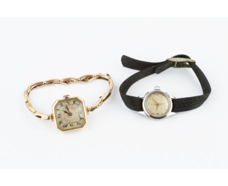 A LADY'S BRACELET WATCH, the octagonal silvered dial with black Arabic numerals, to a jewelled manual wind movement, the case