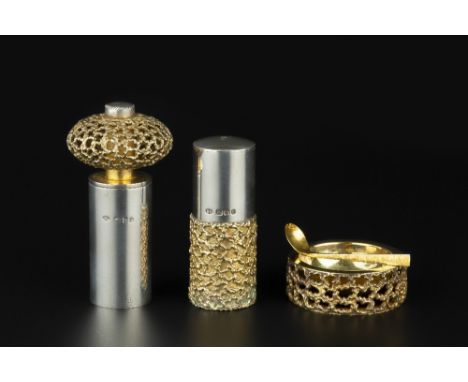 A SILVER AND SILVER GILT THREE PIECE CRUET SET, by Stuart Devlin, London 1971, comprising salt, pepper grinder and an open sa