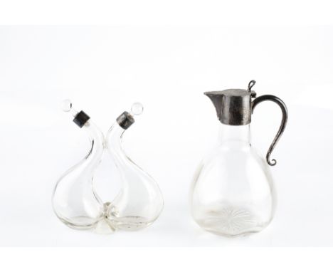 AN EDWARDIAN SILVER MOUNTED GLASS CLARET JUG, with plain rounded body, and simple scroll handle, by J Sherwood &amp; Sons, Bi