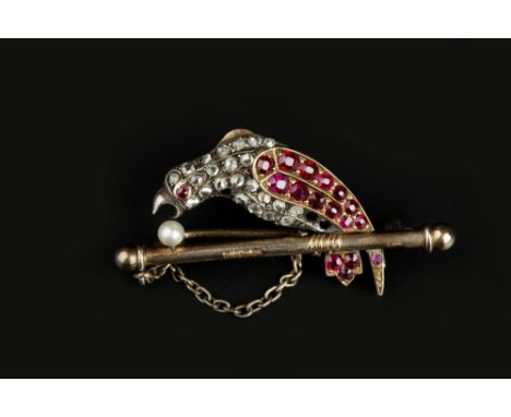 A LATE VICTORIAN DIAMOND AND VARI GEM-SET BIRD BROOCH, modelled as a parrot perched on a branch, his body pavé set with rose-