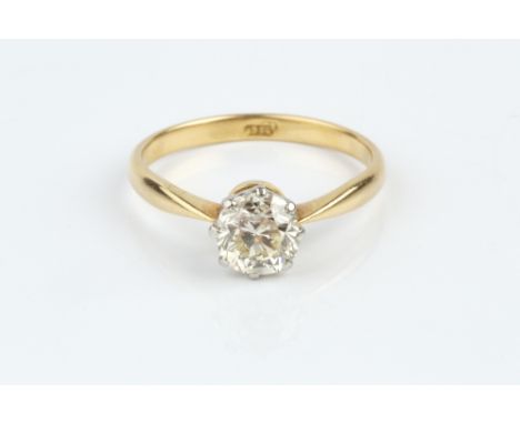 A DIAMOND SINGLE STONE RING, the cushion-shaped old-cut diamond in eight claw setting, two colour precious metal mounted, sta