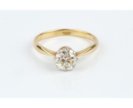 A DIAMOND SINGLE STONE RING, the cushion-shaped old-cut diamond in eight claw setting, two colour precious metal mounted, sta