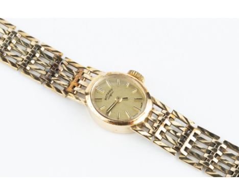 A LADY'S 9CT GOLD BRACELET WATCH BY ROTARY, the oval gilt dial with baton markers, to a jewelled manual wind movement, on a b
