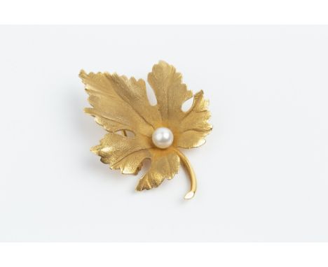 A CULTURED PEARL SET BROOCH BY TIFFANY & CO, modelled as a maple leaf, with single cultured pearl highlight, signed Tiffany &