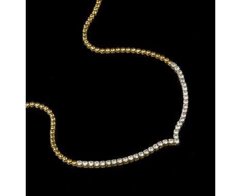 A DIAMOND LINE NECKLACE, designed as a wishbone-shaped line of uniform round brilliant-cut diamonds in four claw settings, on